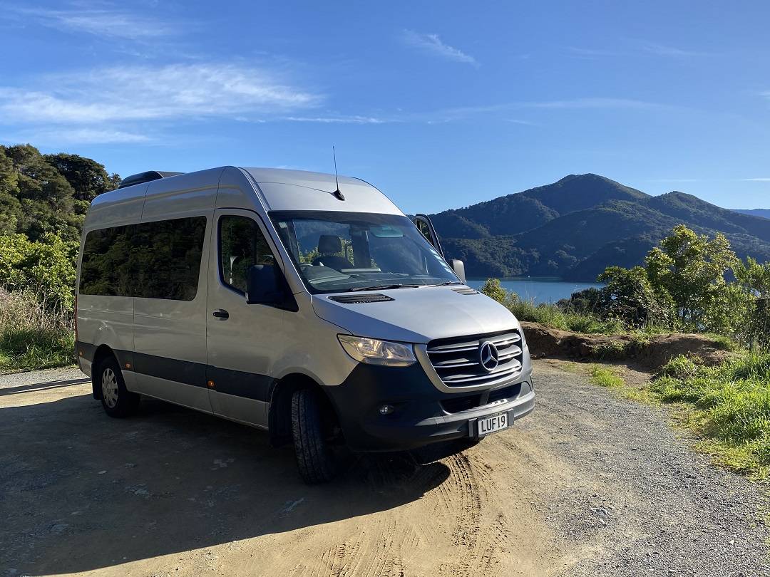 Mercedes van in front of lake